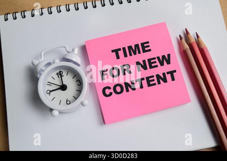Concept of time for new content write on sticky notes isolated on Wooden Table. Stock Photo
