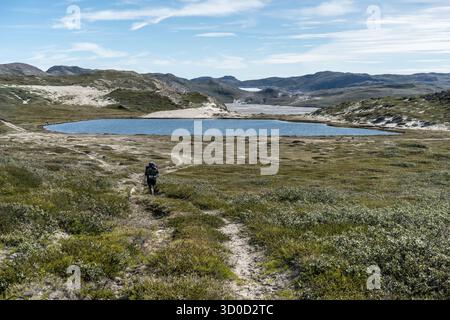 Hikers near Kangerlussuaq on the way to the ice sheet, Sisimiut District, Greenland Stock Photo