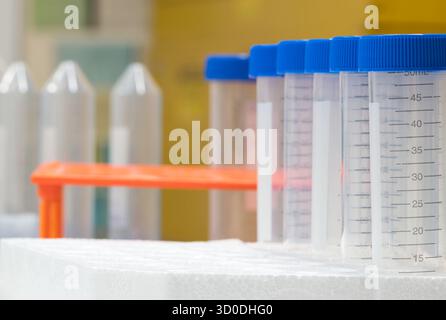 Plastic test tubes empty bottle vials milliliter measurement with caps in styrofoam tray. Stock Photo