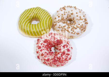 Delicious glazed donuts on white background. Stock Photo