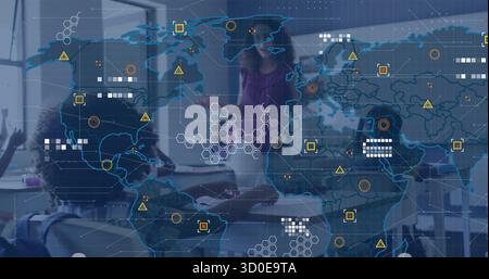 Teaching teacher gesturing toward students at desks with notebooks in classroom, with map overlay Stock Photo