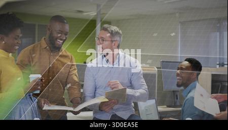 Collaborating colleagues in business attire discussing project in modern office, with tablet Stock Photo