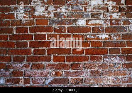 Weathered Stained Old Brick Wall. Weathered texture of stained old dark brown and red brick wall Stock Photo
