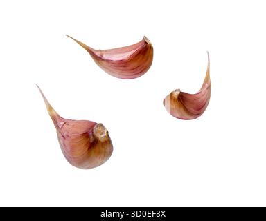 Garlic cloves Isolated on white background.  Composition with garlic cloves falling Stock Photo