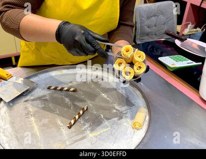 Making traditional Thai ice cream on a cold plate freezer. Thai street food. Dessert. Stock Photo