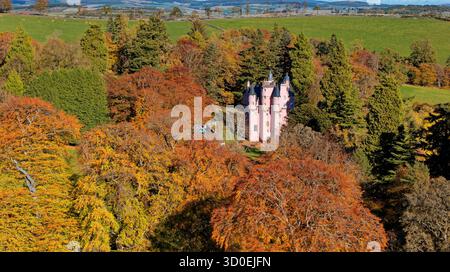 Craigievar Castle Alford Aberdeenshire Scotland trees with sunlit colours of autumn Stock Photo