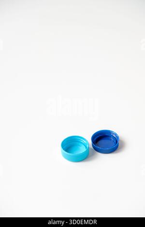 Blue water plastic caps for recycling isolated on white background Stock Photo