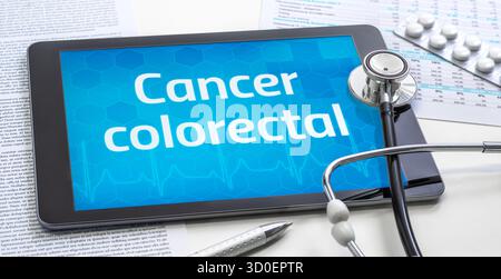 A tablet with the word colon cancer in french on the display Stock Photo