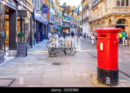 Tourists walking along scenic Trinity street in town centre. Cambridge, England Stock Photo