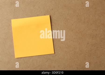 Blank orange note on cork board, space for text Stock Photo