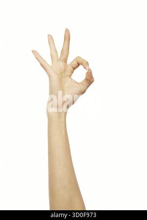 Hand making an okay sign against a white background Stock Photo - Alamy