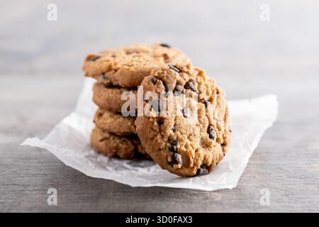 Baked chocolate chip cookies on wooden table Stock Photo