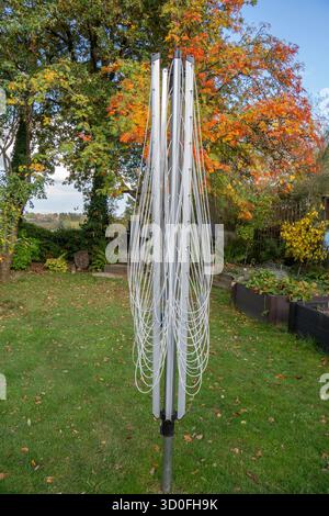 Folded up Rotary washing line on a sunny day Stock Photo
