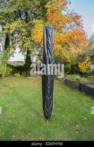 Rotary washing line with a protective cover on it on a sunny day Stock Photo