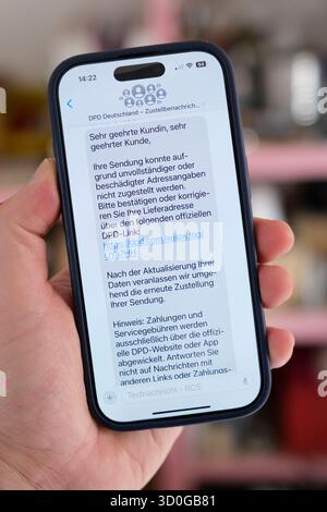 A fraudulent message sent to a mobile phone in the name of the parcel service DPD. Stock Photo