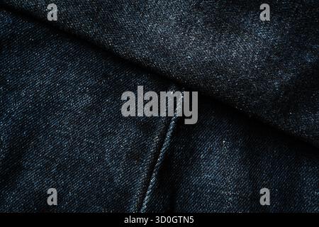 Dark blue jeans with diagonal seam lines texture Stock Photo