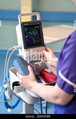 Caption - 23/10/25 - Blood pressure machine being prepared for use by a nurse.  Photo by Paul Slater Images Ltd  - Tel 07512838472. Stock Photo