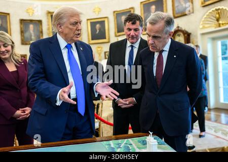 President Donald Trump speaks with Canadian Prime Minister Mark Carney in the Oval Office at the White House in Washington, D.C., on October 7, 2025. The two leaders reviewed bilateral projects and policy initiatives during Carney’s first official visit to the United States. Image courtesy of the White House. Stock Photo