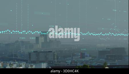 Displaying turquoise data points hovering over apartment blocks and office towers at elevated view Stock Photo