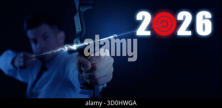 Businessman aiming with bow on dark background. Numbers 2026 with target instead of 0. New year goals and plans Stock Photo