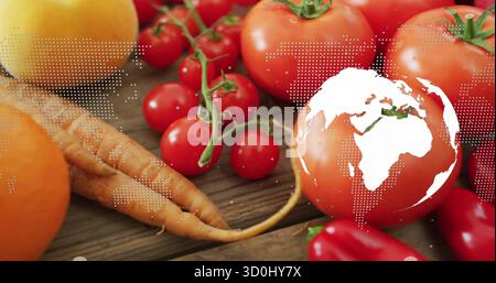 Displaying fresh vegetables on wooden tabletop, with map overlay and globe graphic Stock Photo