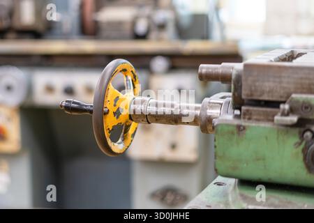 Old worn out milling machine control panel and control dial in a workshop Stock Photo