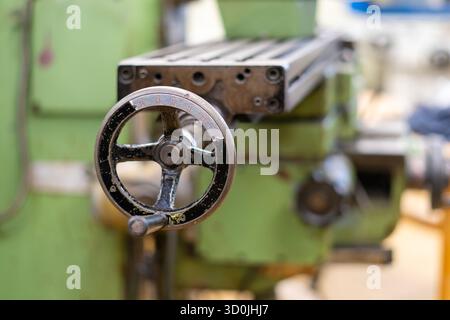 Old worn out milling machine control panel and control dial in a workshop Stock Photo