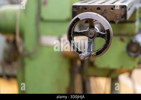 Old worn out milling machine control panel and control dial in a workshop Stock Photo