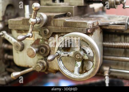 Old worn out milling machine control panel and control dial in a workshop Stock Photo