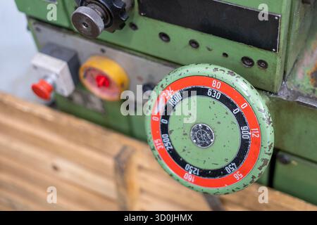 Old worn out milling machine control panel and control dial in a workshop Stock Photo