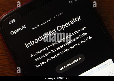 Smartphone displaying OpenAI's Operator launch page, introducing a browser-capable AI agent for task automation and research preview. Stock Photo