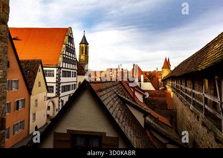 View of rooftops in a historic Bavarian town under a bright blue sky. Traditional German architecture and charming old city atmosphere. Stock Photo
