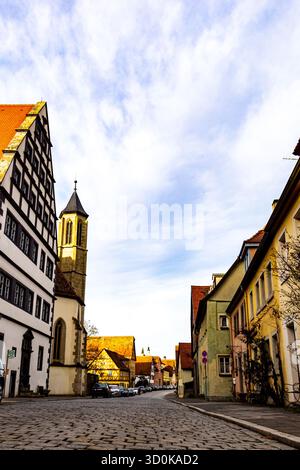 Beautiful empty street in the historic Bavarian town of Rothenburg ob der Tauber on a sunny day. Traditional German houses Stock Photo