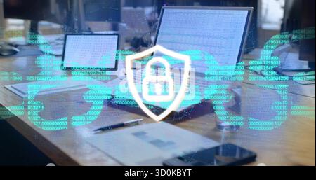 Projecting shield icon and world map data in office with laptop tablet smartphone documents and pen Stock Photo