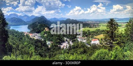 Panoramic landscape of Hohenschwangau village and Alpsee Lake, Bavaria, Germany, near the iconic Neuschwanstein Castle. Stock Photo