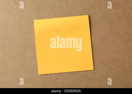 Blank orange note on cork board, space for text Stock Photo