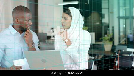 Professionals in professional attire analyzing data on laptop in office, with digital grid overlay Stock Photo