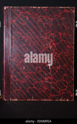 A closed antique book cover featuring a dark red and black marbled paper pattern overlaid on a subtle striped (moiré) texture. The spine area is solid Stock Photo
