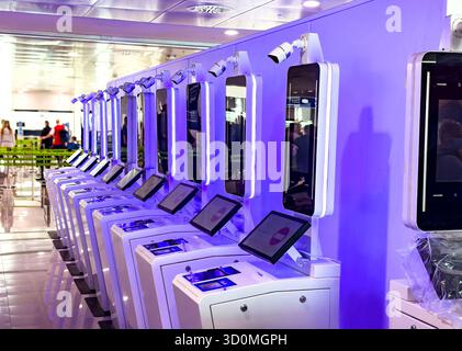 Row of new self-service EES entry/exit immigration kiosks with digital touchscreens and biometric scanners in palma airport terminal mallorca spain Stock Photo