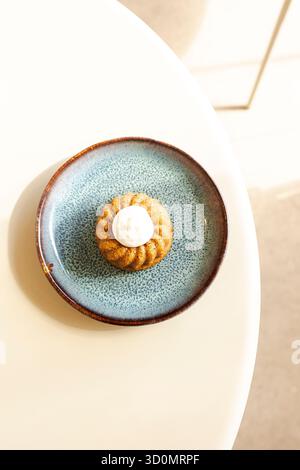 Mini bundt cake with frosting on plate Stock Photo