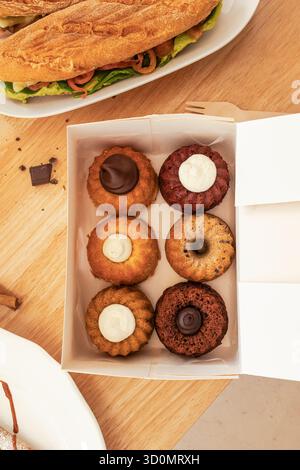 Assorted mini bundt cakes in takeaway box Stock Photo