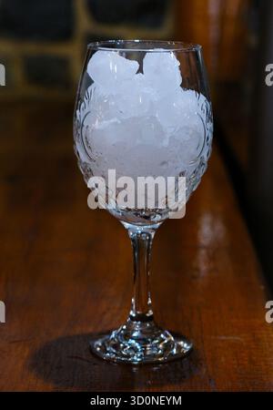 Mineral water bottle isolated on white background with clipping path. Drink water, soda and ice cubes with bubble. Splash of natural minerals water in a glass. Ice blocks, Soft drinks , Drinking. Stock Photo