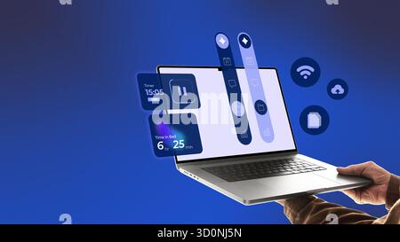 Bold artwork. Hands holding laptop with blue interface icons showing data visualization and cloud control Stock Photo