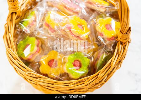 Wrapped Easter Cookie Sandwiches in Basket Stock Photo
