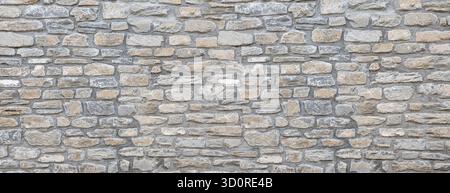Stone wall showing irregular blocks creating a solid patterned background Stock Photo