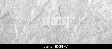 White uneven plaster wall creating a rough abstract texture for backgrounds Stock Photo