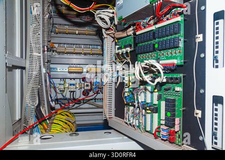 Server cabinet in the server room, with microchips and wires Stock Photo