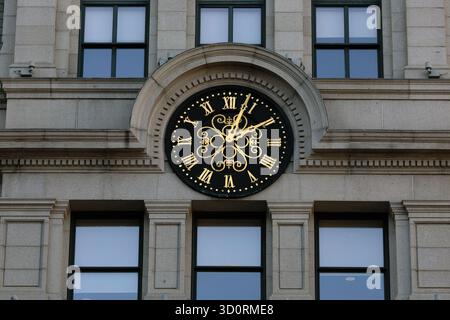 Decorative Roman Numeral Clock on Historic Stone Building Facade, Pemberton Square, Boston Stock Photo