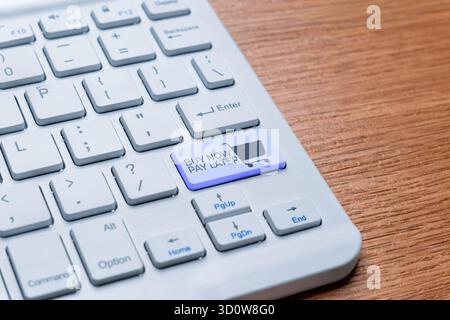 A keyboard key labeled "BUY NOW PAY LATER" with a shopping cart icon. Installment payment options in e-commerce and online shopping concept. Stock Photo