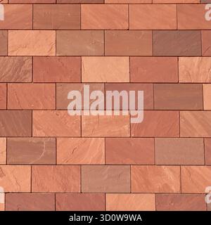 Abstract full-frame close-up of a wall of brown, terracotta-colored, and reddish rectangular bricks, showcasing their varied textures and hues in a pr Stock Photo